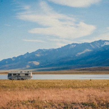 RV parked against Montana mountains and big sky